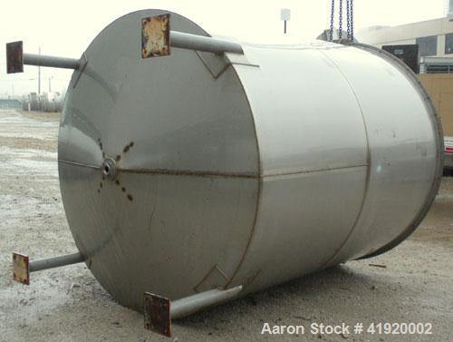 Used Tank, 4200 Gallon, 304 Stainless Steel, Vertical. 100" diameter x 120" straight side, flat open top with a bolt on cover with a hinged access door, coned bottom. Bolt on carbon steel agitator br...