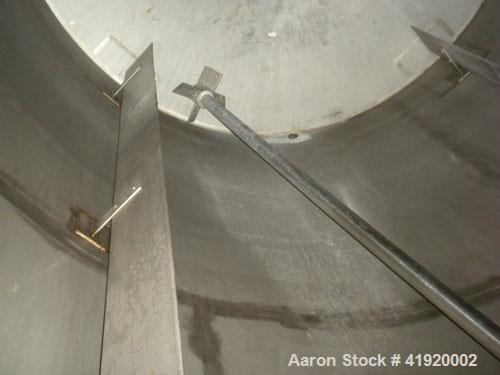 Used Tank, 4200 Gallon, 304 Stainless Steel, Vertical. 100" diameter x 120" straight side, flat open top with a bolt on cover with a hinged access door, coned bottom. Bolt on carbon steel agitator br...