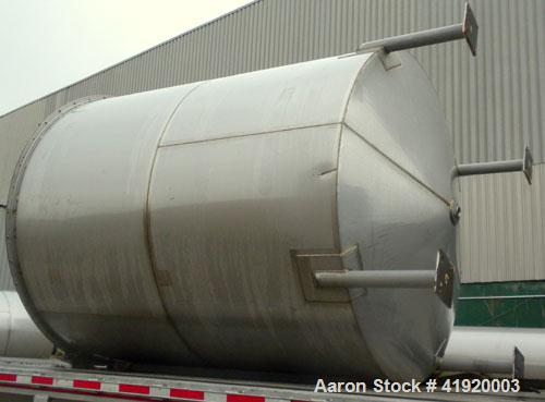 Used Tank, 4200 Gallon, 304 Stainless Steel, Vertical. 100" diameter x 120" straight side, flat open top with a bolt on cover with a hinged access door, coned bottom. Bolt on carbon steel agitator br...