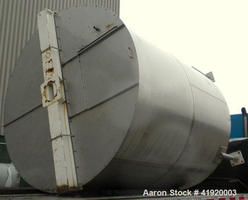Used Tank, 4200 Gallon, 304 Stainless Steel, Vertical. 100" diameter x 120" straight side, flat open top with a bolt on cover with a hinged access door, coned bottom. Bolt on carbon steel agitator br...