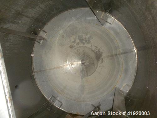 Used Tank, 4200 Gallon, 304 Stainless Steel, Vertical. 100" diameter x 120" straight side, flat open top with a bolt on cover with a hinged access door, coned bottom. Bolt on carbon steel agitator br...