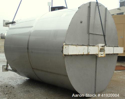 Used Tank, 4200 Gallon, 304 Stainless Steel, Vertical. 100" diameter x 120" straight side, flat open top with a bolt on cover with a hinged access door, coned bottom. Bolt on carbon steel agitator br...