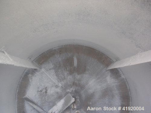 Used Tank, 4200 Gallon, 304 Stainless Steel, Vertical. 100" diameter x 120" straight side, flat open top with a bolt on cover with a hinged access door, coned bottom. Bolt on carbon steel agitator br...