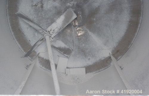 Used Tank, 4200 Gallon, 304 Stainless Steel, Vertical. 100" diameter x 120" straight side, flat open top with a bolt on cover with a hinged access door, coned bottom. Bolt on carbon steel agitator br...