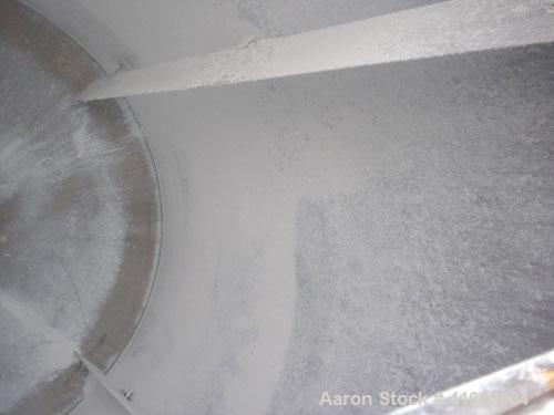 Used Tank, 4200 Gallon, 304 Stainless Steel, Vertical. 100" diameter x 120" straight side, flat open top with a bolt on cover with a hinged access door, coned bottom. Bolt on carbon steel agitator br...
