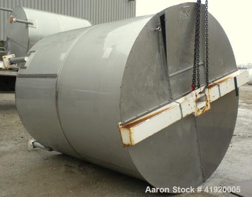 Used Tank, 4200 Gallon, 304 Stainless Steel, Vertical. 100" diameter x 120" straight side, flat open top with a bolt on cover with a hinged access door, coned bottom. Bolt on carbon steel agitator br...