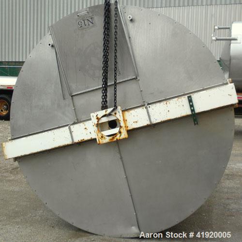 Used Tank, 4200 Gallon, 304 Stainless Steel, Vertical. 100" diameter x 120" straight side, flat open top with a bolt on cover with a hinged access door, coned bottom. Bolt on carbon steel agitator br...