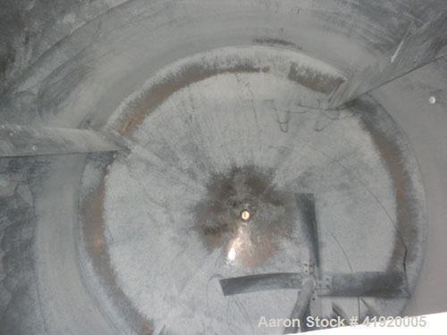 Used Tank, 4200 Gallon, 304 Stainless Steel, Vertical. 100" diameter x 120" straight side, flat open top with a bolt on cover with a hinged access door, coned bottom. Bolt on carbon steel agitator br...