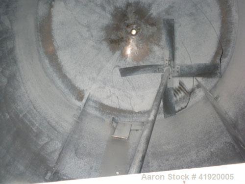 Used Tank, 4200 Gallon, 304 Stainless Steel, Vertical. 100" diameter x 120" straight side, flat open top with a bolt on cover with a hinged access door, coned bottom. Bolt on carbon steel agitator br...