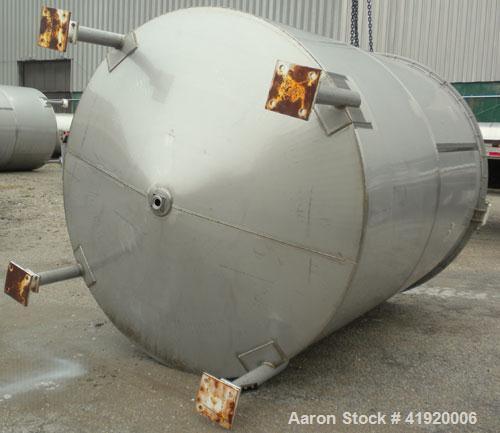 Used Tank, 4200 Gallon, 304 Stainless Steel, Vertical. 100" diameter x 120" straight side, flat open top with a bolt on cover with a hinged access door, coned bottom. Bolt on carbon steel agitator br...