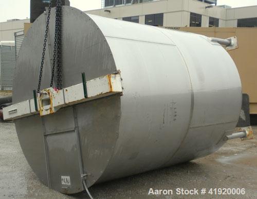 Used Tank, 4200 Gallon, 304 Stainless Steel, Vertical. 100" diameter x 120" straight side, flat open top with a bolt on cover with a hinged access door, coned bottom. Bolt on carbon steel agitator br...