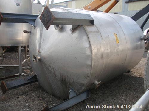 Used Tank, 2800 Gallon, 316 Stainless Steel, Vertical. 84" diameter x 116" straight side, coned top and bottom. Openings: top (2) 3"; side (2) 3"; 24" side bottom manway with cover; approximate 3-1/2...