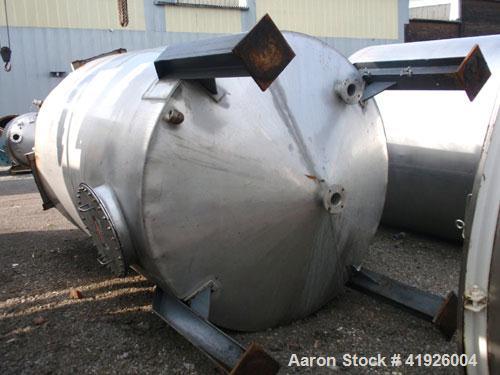 Used Tank, 2800 Gallon, 316 Stainless Steel, Vertical. 84" diameter x 116" straight side, coned top and bottom. Openings: top (2) 3"; side (2) 3"; 24" side bottom manway with cover; approximate 3-1/2...