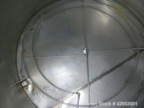 Used Tank, 2000 Gallon, 304 Stainless Steel, Vertical. 84" Diameter x 81" straight side. Flat welded top, sloped bottom, with custom made sparge ring. (1) Spray ball. Openings: top (2) 1", 1-1/2", 2-...