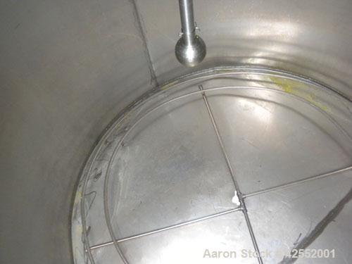 Used Tank, 2000 Gallon, 304 Stainless Steel, Vertical. 84" Diameter x 81" straight side. Flat welded top, sloped bottom, with custom made sparge ring. (1) Spray ball. Openings: top (2) 1", 1-1/2", 2-...