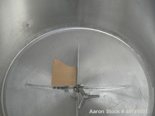 Used Tank, 1200 gallon, 316 stainless steel, vertical. 72" diameter x 62" straight side. Open top with (2) 1/3 covers, dished bottom. Provision for a clamp-on agitator. 3 1/2" center bottom outlet. M...