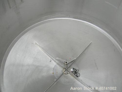 Used Tank, 1200 gallon, 316 stainless steel, vertical. 72" diameter x 62" straight side. Open top with (2) 1/3 covers, dished bottom. Provision for a clamp-on agitator. 3 1/2" center bottom outlet. M...