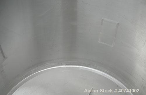 Used Tank, 1200 gallon, 316 stainless steel, vertical. 72" diameter x 62" straight side. Open top with (2) 1/3 covers, dished bottom. Provision for a clamp-on agitator. 3 1/2" center bottom outlet. M...