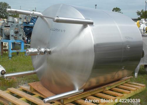 Used Tank, 1200 Gallon, 316 Stainless Steel, Vertical. 70" Diameter x 72" straight side, dished top and bottom. Openings: top (4) 2" tri-clamp, (2) 3" tri-clamp, 4" tri-clamp, 16" manway with cover; ...