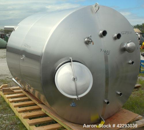 Used Tank, 1200 Gallon, 316 Stainless Steel, Vertical. 70" Diameter x 72" straight side, dished top and bottom. Openings: top (4) 2" tri-clamp, (2) 3" tri-clamp, 4" tri-clamp, 16" manway with cover; ...