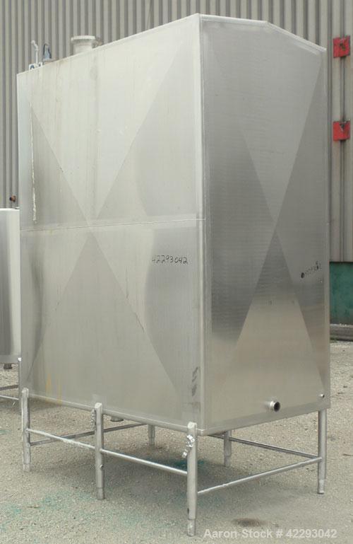 Used Rectangular Tank, 1500 Gallon, 316 Stainless Steel, Vertical. Approximately 76" long x 48" wide x 94" tall. Gabled top, flat bottom. Openings: top (2) 1-1/2" NPT, 3-1/2" threaded, (2) 2" tri-cla...