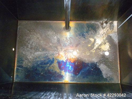 Used Rectangular Tank, 1500 Gallon, 316 Stainless Steel, Vertical. Approximately 76" long x 48" wide x 94" tall. Gabled top, flat bottom. Openings: top (2) 1-1/2" NPT, 3-1/2" threaded, (2) 2" tri-cla...