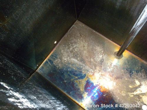 Used Rectangular Tank, 1500 Gallon, 316 Stainless Steel, Vertical. Approximately 76" long x 48" wide x 94" tall. Gabled top, flat bottom. Openings: top (2) 1-1/2" NPT, 3-1/2" threaded, (2) 2" tri-cla...