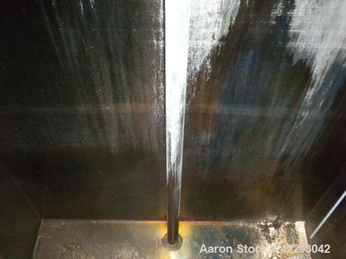 Used Rectangular Tank, 1500 Gallon, 316 Stainless Steel, Vertical. Approximately 76" long x 48" wide x 94" tall. Gabled top, flat bottom. Openings: top (2) 1-1/2" NPT, 3-1/2" threaded, (2) 2" tri-cla...