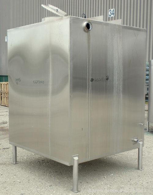 Used Square Tank, 1400 Gallon, 304 stainless steel, vertical. Approximately 66" long x 66" wide x 76" tall. Flat top and bottom. Openings: top 1" tri-clamp, 1-1/2" tri-clamp, 2" tri-clamp, (3) 3" tri...
