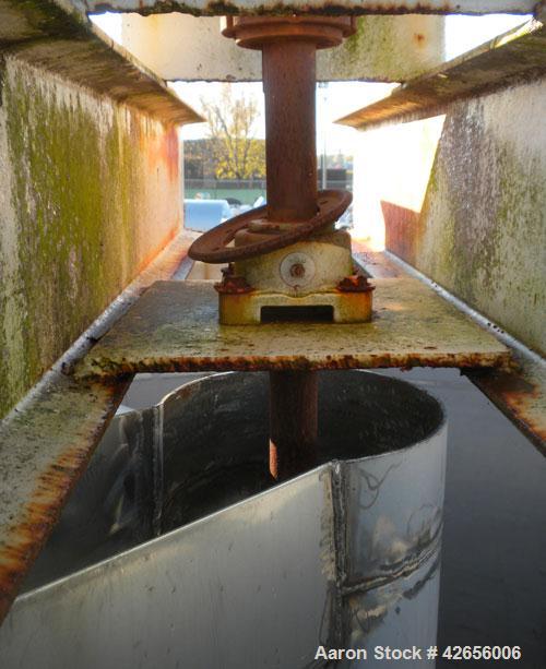 Used Tank, 1100 Gallon, 304 Stainless Steel, Vertical. 72" Diameter x 62" straight side x 42" coned bottom, open top with no covers. Carbon steel agitator bridge, approximate 2" diameter carbon steel...