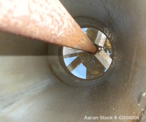 Used Tank, 1100 Gallon, 304 Stainless Steel, Vertical. 72" Diameter x 62" straight side x 42" coned bottom, open top with no covers. Carbon steel agitator bridge, approximate 2" diameter carbon steel...