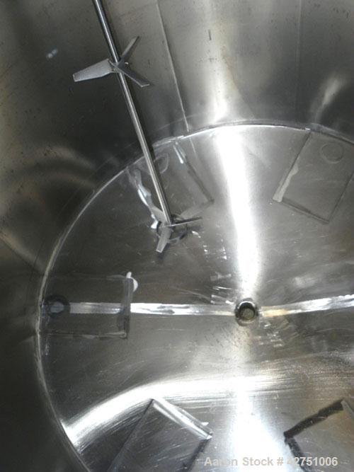 Used Tank, 2000 Gallon, Stainless Steel, Vertical. 84" Diameter x 80" straight side. Dished top, coned bottom. Off center top entering Lightnin agitator, model XJC-117. 1-1/2" Diameter shaft with (2)...