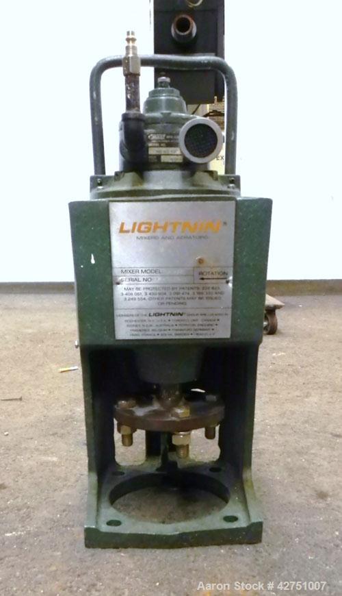 Used Tank, 2000 Gallon, 304 Stainless Steel, Vertical. 84" Diameter x 80" straight side. Dished top, coned bottom. Off center top entering Lightnin air operated agitator, model XJAC-100. 1-1/2" Diame...