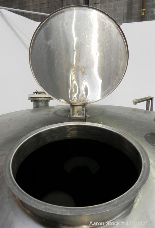 Used Tank, 2000 Gallon, 304 Stainless Steel, Vertical. 84" Diameter x 80" straight side. Dished top, coned bottom. Off center top entering Lightnin air operated agitator, model XJAC-100. 2" Diameter ...