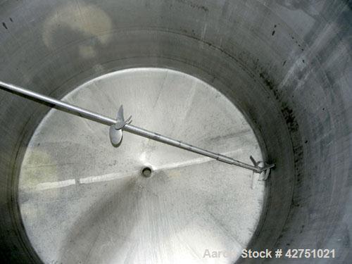 Used Tank, 2000 Gallon, 304 Stainless Steel, Vertical. 84" Diameter x 80" straight side. Dished top, coned bottom. Off center top entering Lightnin air operated agitator, model XJAC-100. 2" Diameter ...