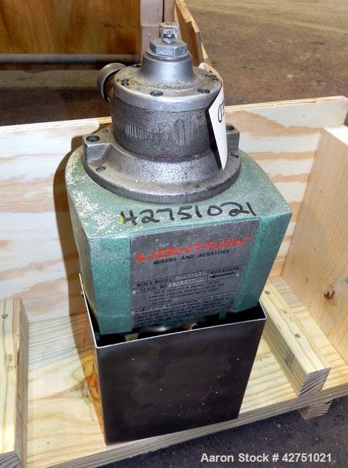 Used Tank, 2000 Gallon, 304 Stainless Steel, Vertical. 84" Diameter x 80" straight side. Dished top, coned bottom. Off center top entering Lightnin air operated agitator, model XJAC-100. 2" Diameter ...