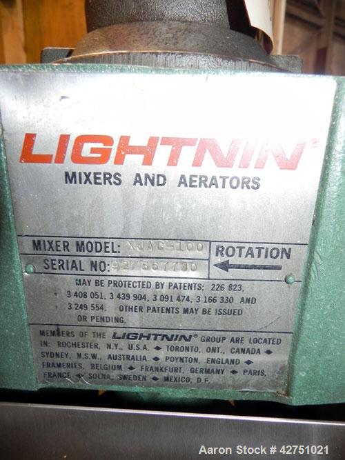 Used Tank, 2000 Gallon, 304 Stainless Steel, Vertical. 84" Diameter x 80" straight side. Dished top, coned bottom. Off center top entering Lightnin air operated agitator, model XJAC-100. 2" Diameter ...