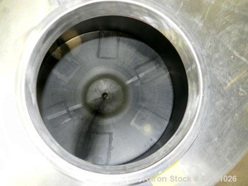 Used Tank, 2000 Gallon, 304 Stainless Steel Vertical. 84" Diameter x 80" straight side. Dished top, coned bottom. Openings top (2) 2", 4", 6", 18" man way with cover, side 2". 3" Threaded center bott...