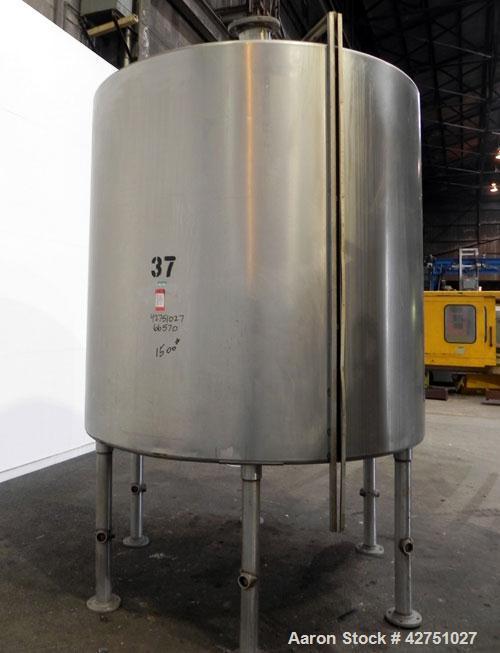 Used Tank, 2000 Gallon, 304 Stainless Steel Vertical. 84" Diameter x 80" straight side. Dished top, coned bottom. Openings top (2) 2", 4", 8", 18" man way with cover, side 2". 3" Threaded center bott...