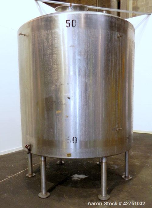 Used Tank, 2000 Gallon, 304 Stainless Steel Vertical. 84" Diameter x 80" straight side. Dished top, coned bottom. Openings top (2) 2", 4", 6", 18" man way with cover, side 2". 3" Threaded center bott...