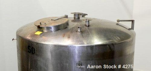 Used Tank, 2000 Gallon, 304 Stainless Steel Vertical. 84" Diameter x 80" straight side. Dished top, coned bottom. Openings top (2) 2", 4", 6", 18" man way with cover, side 2". 3" Threaded center bott...