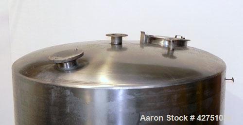 Used Tank, 2000 Gallon, 304 Stainless Steel Vertical. 84" Diameter x 80" straight side. Dished top, coned bottom. Openings top (2) 2", 4", 6", 18" man way with cover, side 2". 3" Threaded center bott...