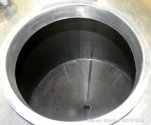 Used Tank, 2000 Gallon, 304 Stainless Steel Vertical. 84" Diameter x 80" straight side. Dished top, coned bottom. Openings top (2) 2", 4", 6", 18" man way with cover, side 2". 3" Threaded center bott...