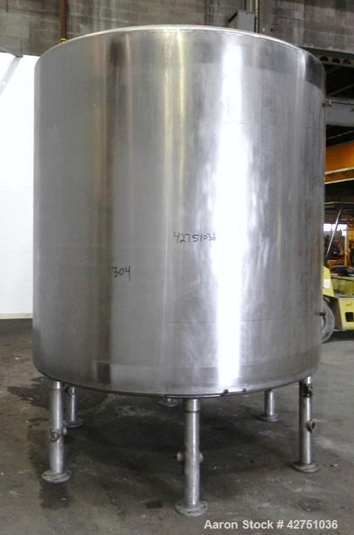 Used Tank, 2000 Gallon, 304 Stainless Steel Vertical. 84" Diameter x 80" straight side. Dished top, coned bottom. Openings top 2", 6", 18" man way with cover, side 2". 3" Tri-clamp center bottom outl...
