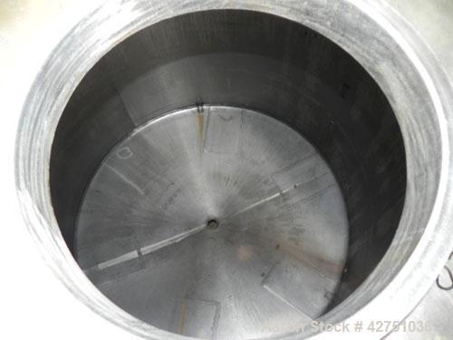 Used Tank, 2000 Gallon, 304 Stainless Steel Vertical. 84" Diameter x 80" straight side. Dished top, coned bottom. Openings top 2", 6", 18" man way with cover, side 2". 3" Tri-clamp center bottom outl...