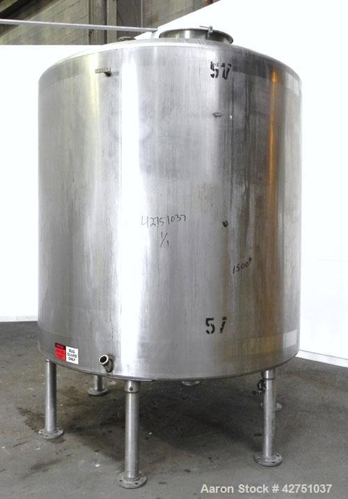 Used Tank, 2000 Gallon, 304 Stainless Steel Vertical. 84" Diameter x 80" straight side. Dished top, coned bottom. Openings top 2", 6", 18" man way with cover, side 2". 3" Tri-clamp center bottom outl...