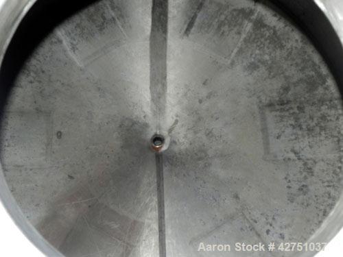 Used Tank, 2000 Gallon, 304 Stainless Steel Vertical. 84" Diameter x 80" straight side. Dished top, coned bottom. Openings top 2", 6", 18" man way with cover, side 2". 3" Tri-clamp center bottom outl...