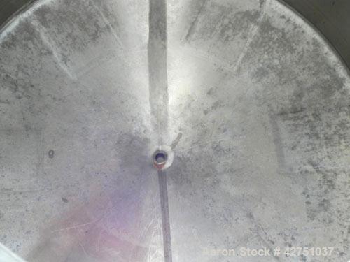 Used Tank, 2000 Gallon, 304 Stainless Steel Vertical. 84" Diameter x 80" straight side. Dished top, coned bottom. Openings top 2", 6", 18" man way with cover, side 2". 3" Tri-clamp center bottom outl...