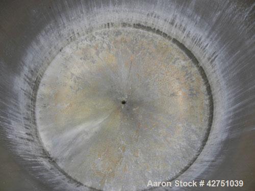 Used Tank, 2000 Gallon, 304 Stainless Steel Vertical. 84" Diameter x 80" straight side. Dished top, coned bottom. Openings top 2", 6", 18" man way with cover. 3" Tri-clamp center bottom outlet. Mount...