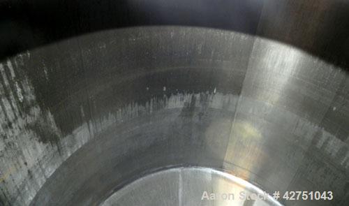 Used Tank, 2000 Gallon, 304 Stainless Steel Vertical. 84" Diameter x 80" straight side. Dished top, coned bottom. Openings top 2", 4", 18" man way with cover, side 2". 2" Tri-clamp center bottom outl...